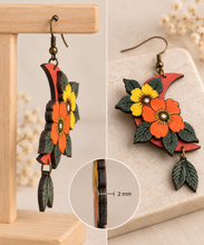 Cargar imagen en el visor de la galería, Moon Flower layered wooden earrings in side and angled views showing the 2 mm wood thickness and raised floral layers