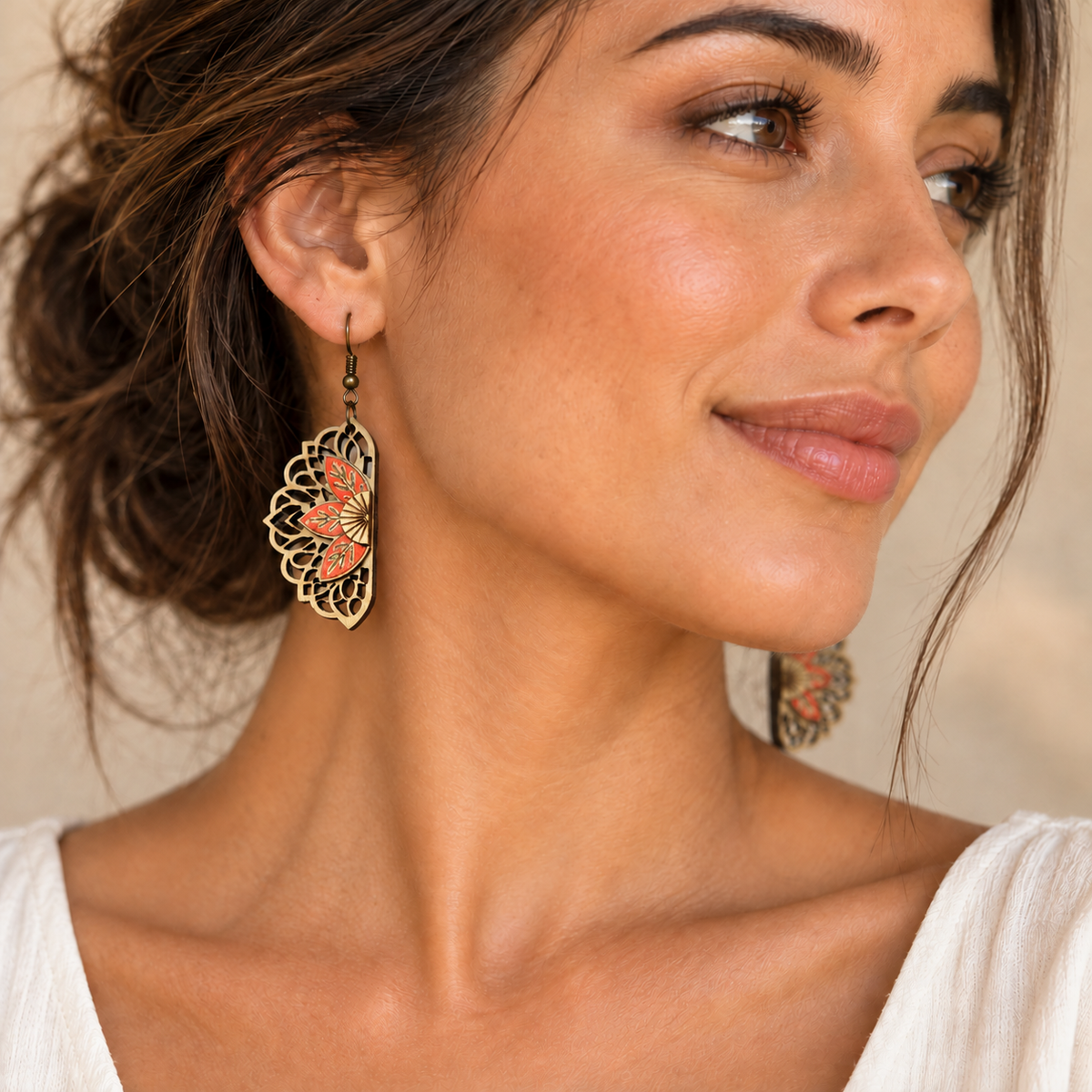 Model wearing Floral Mandala coral and natural wood earrings with an ivory top and hair pulled back.