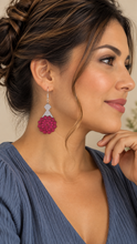 Cargar imagen en el visor de la galería, Model wearing a Mystic Mandala Bloom wooden earring with a soft slate-blue top, showing the approximately 2-inch layered earring at a natural scale.
