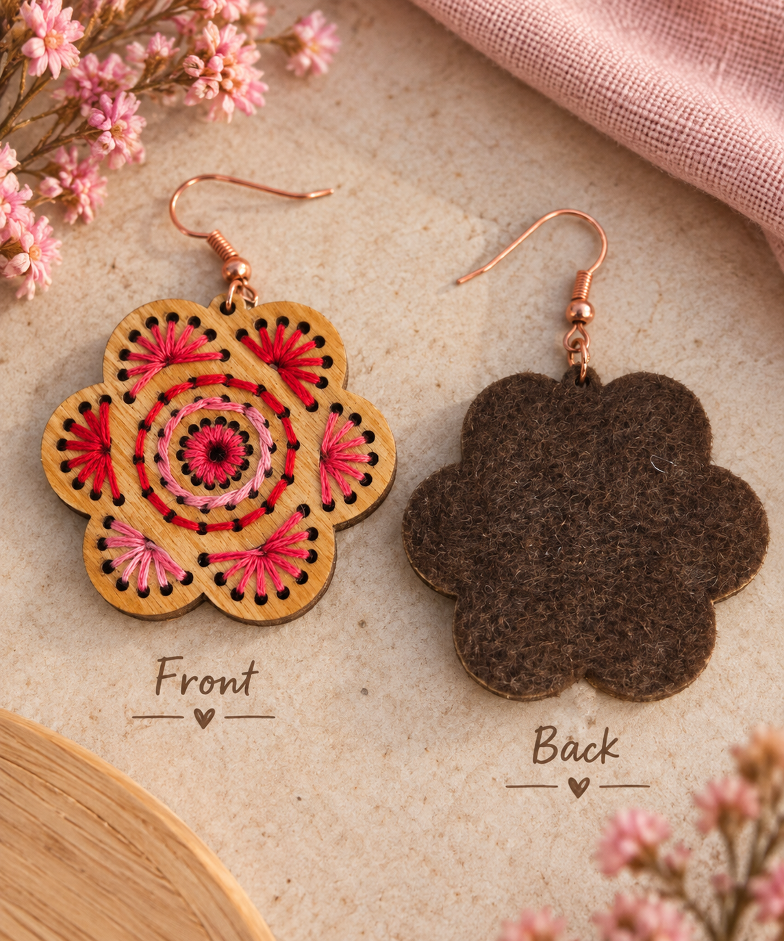 Front and back view of Natural Splendor wooden earrings showing hand embroidery on natural wood and brown felt backing that protects the threads