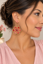 Cargar imagen en el visor de la galería, Model wearing Natural Splendor lightweight wooden flower earrings with red and pink hand embroidery and bronze-tone hooks
