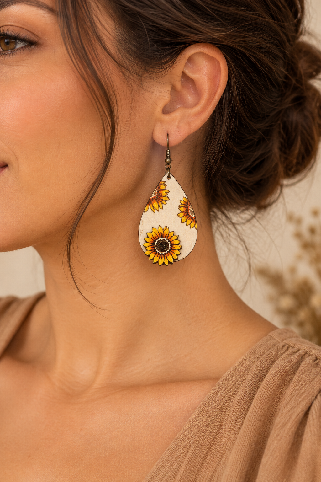 Model wearing Sunflower Glow lightweight 3D wooden earrings with a camel top